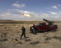 Ливийские повстанцы ведут ракетный обстрел,  Ливия. Фото: AP